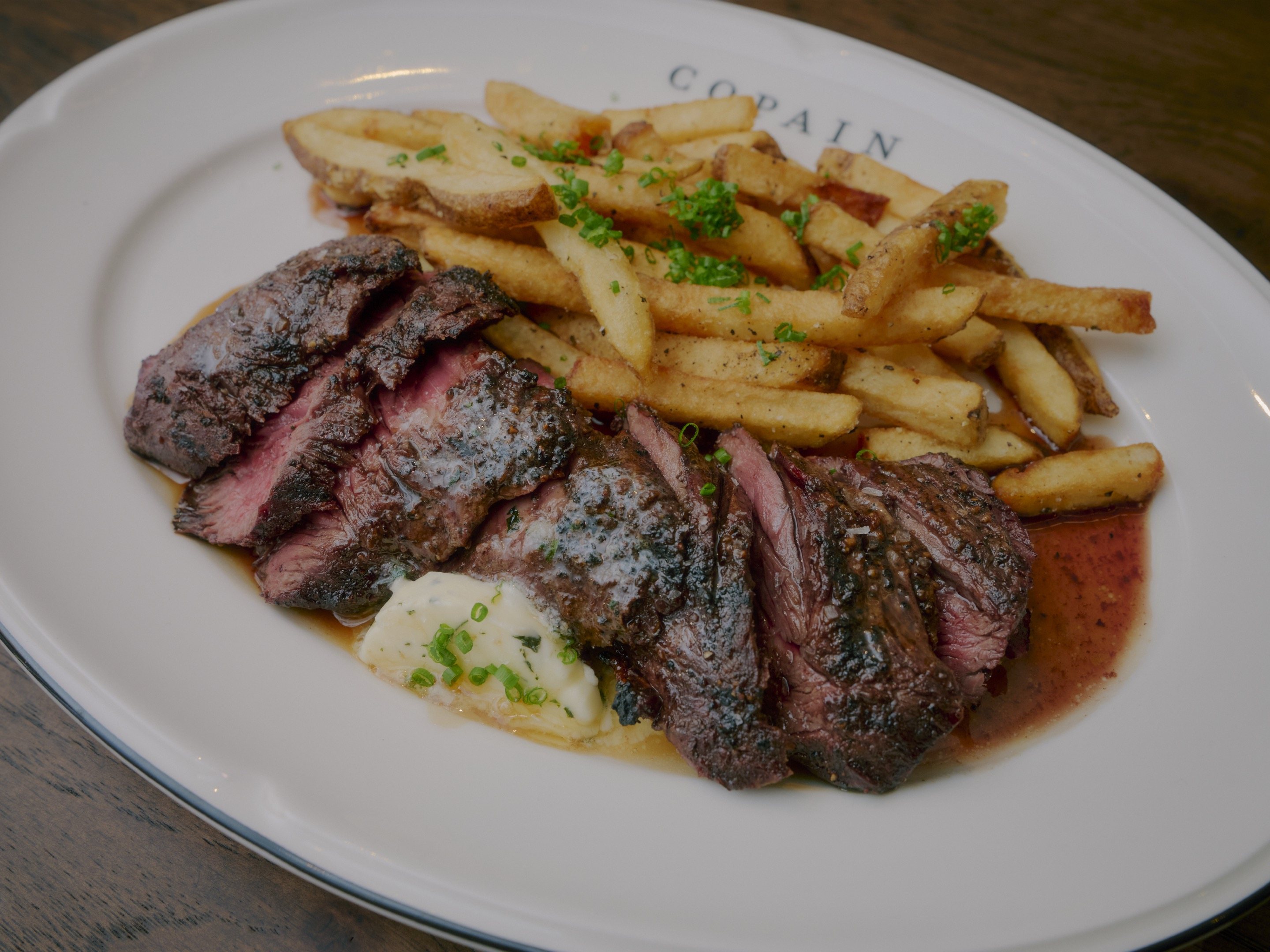 Dinner at Brasserie Copain in Ballantyne — evening brasserie service at the table