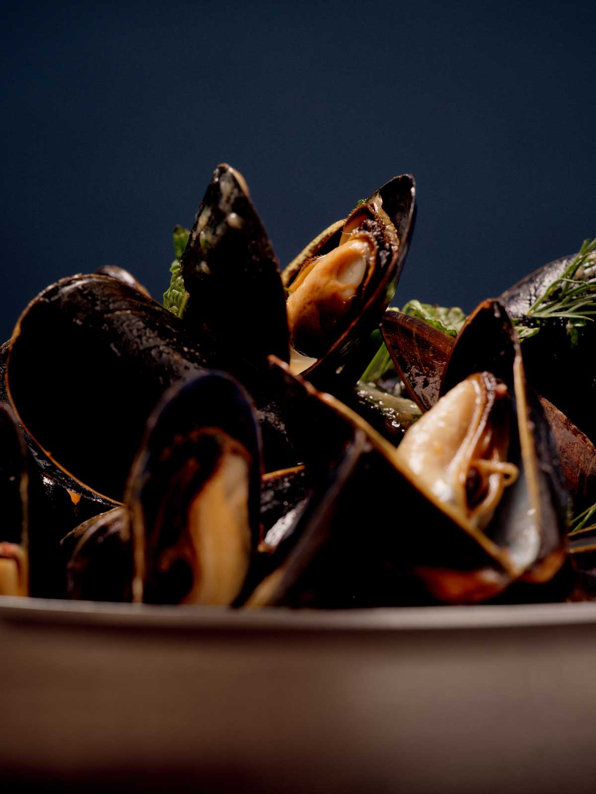 Ballantyne dinner service — plated brasserie dishes on the kitchen pass