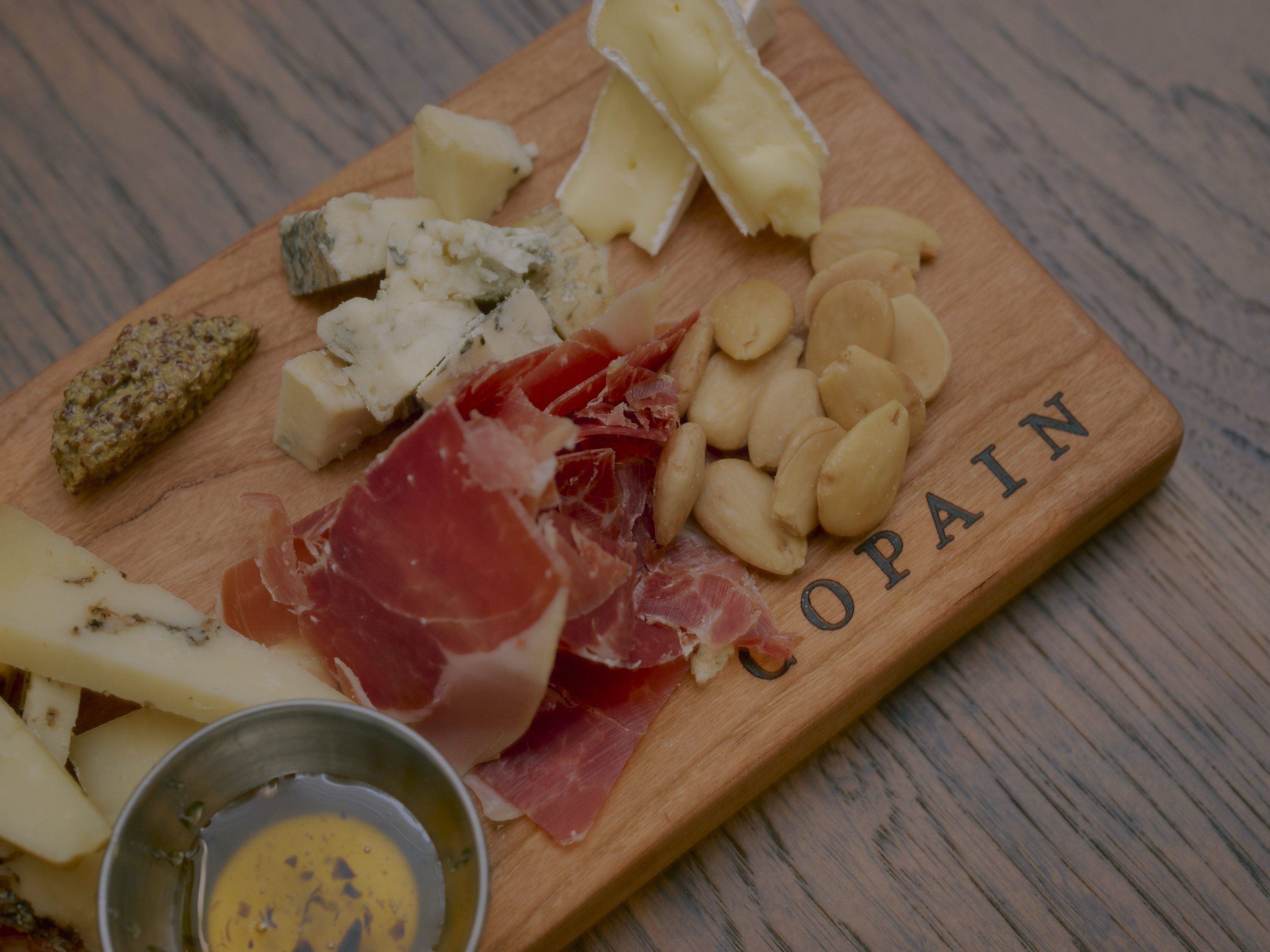 Copain charcuterie and cheese board with prosciutto, blue cheese and Dijon